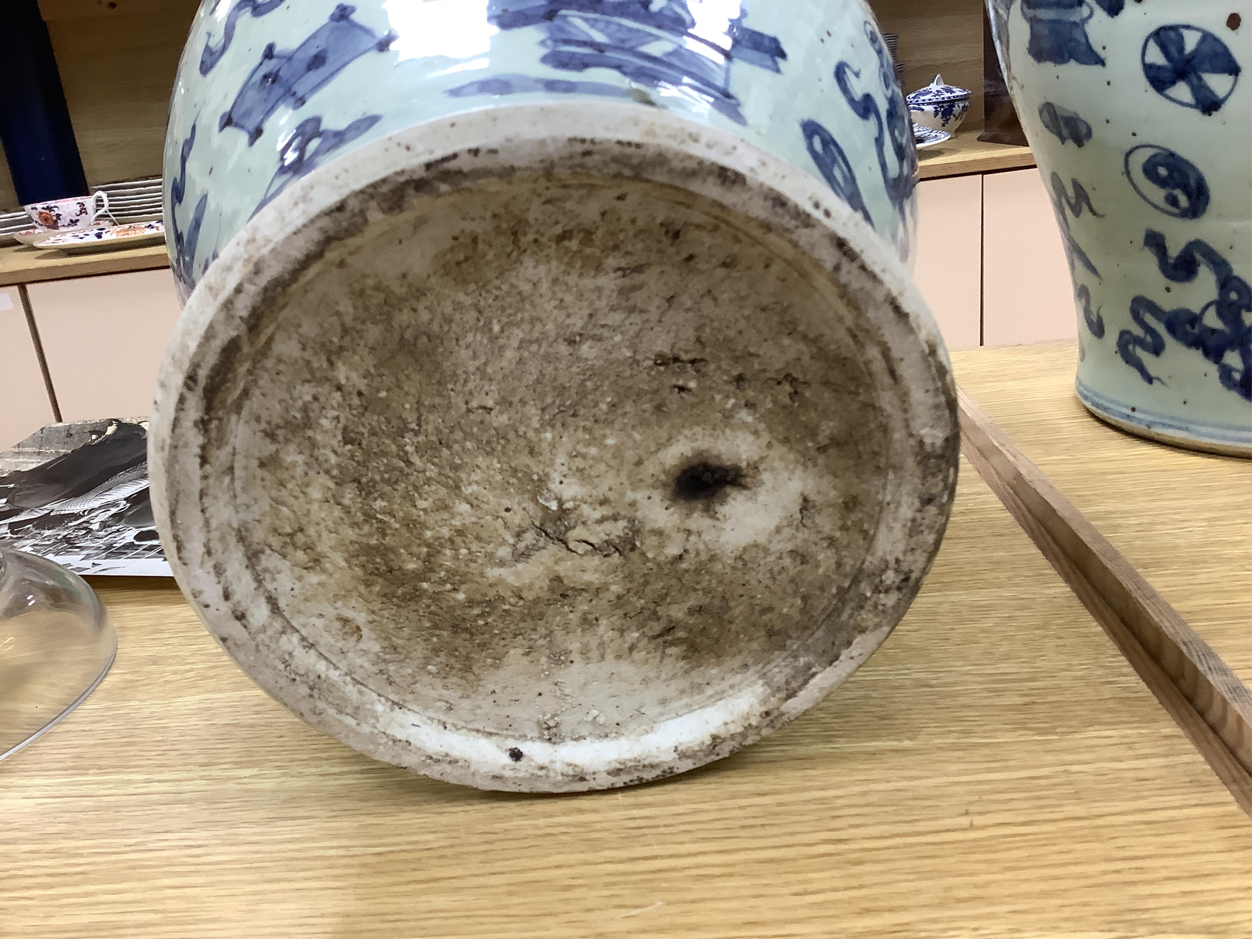 A large pair of Chinese blue and white ginger jars and covers, 54cm high. Condition - fair to good